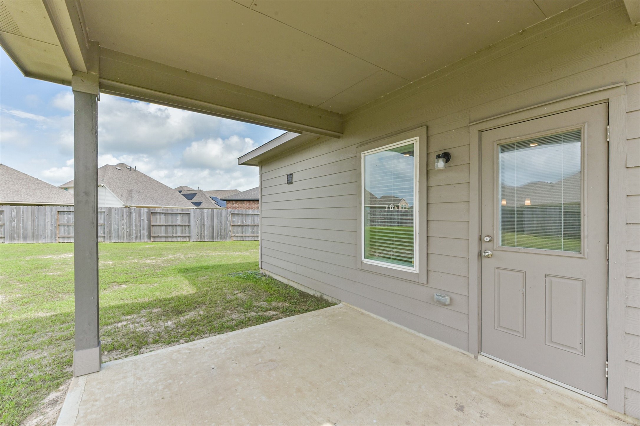 3607 Crosspointe Pass Angleton, TX 77515 - Photo 37 of 46 a view of a back yard from a porch