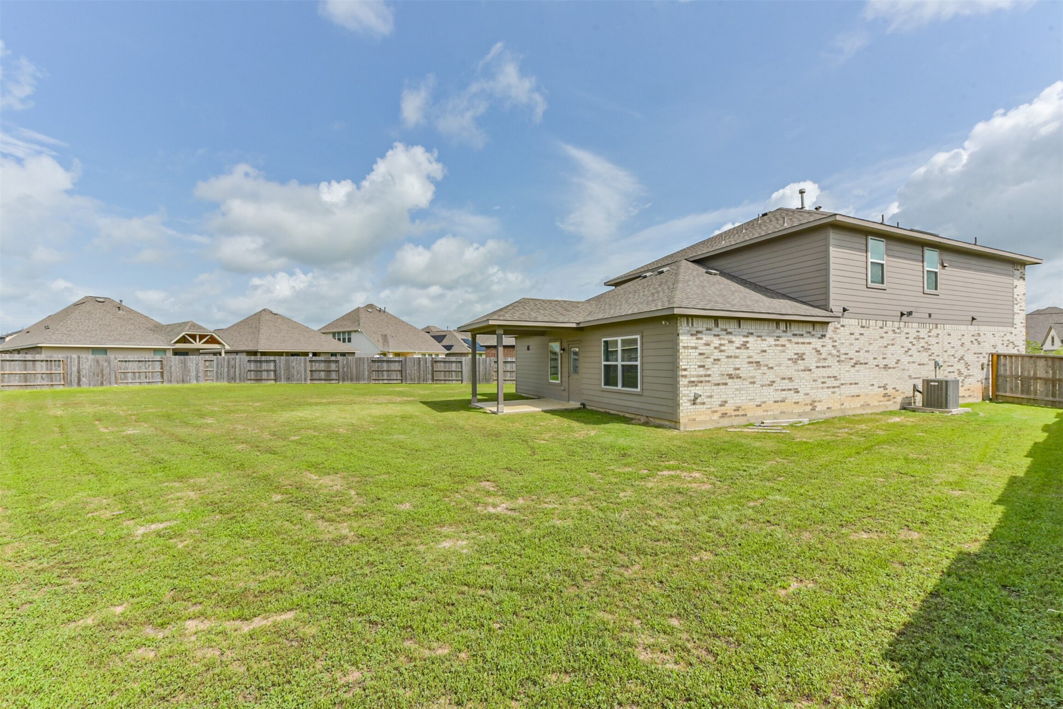 3607 Crosspointe Pass Angleton, TX 77515 - Photo 38 of 46 a view of a house with a yard and sitting area