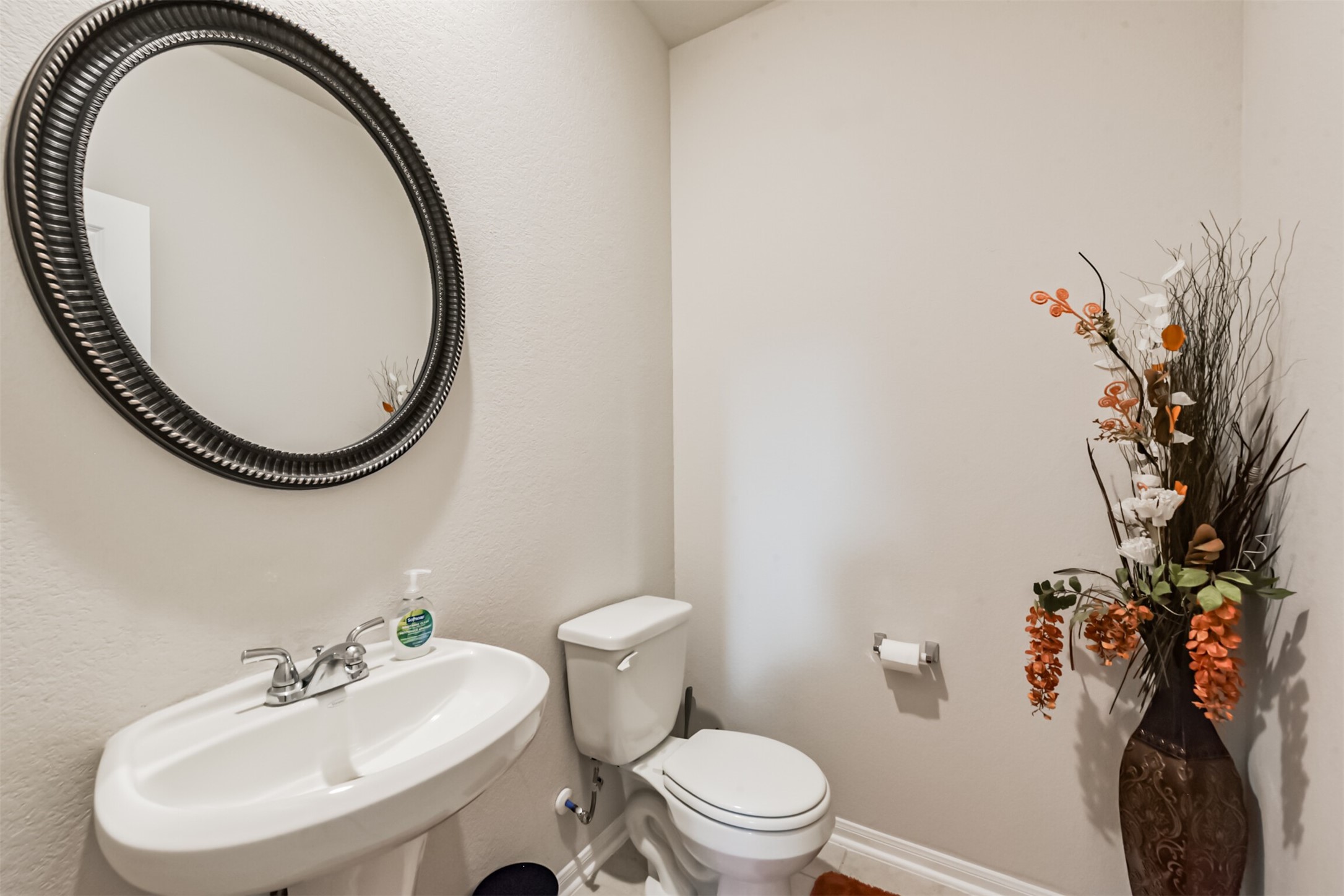3607 Crosspointe Pass Angleton, TX 77515 - Photo 7 of 46 a bathroom with a sink and a mirror