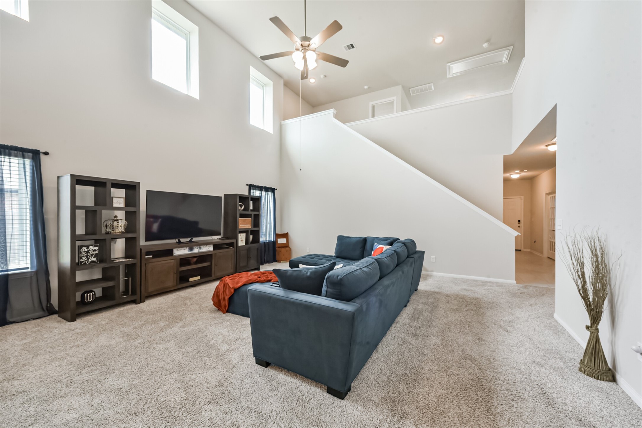 3607 Crosspointe Pass Angleton, TX 77515 - Photo 10 of 46 a living room with furniture and a flat screen tv