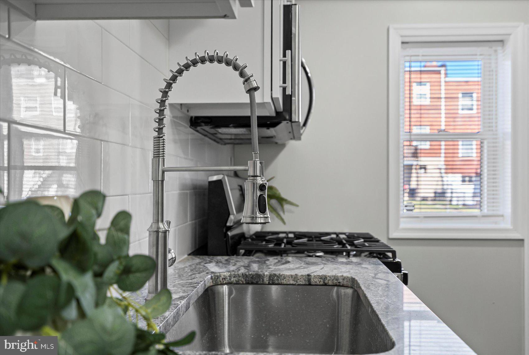 3814 Flowerton Road Baltimore, MD 21229 - Photo 11 of 42 a view of a bathroom sink and a window