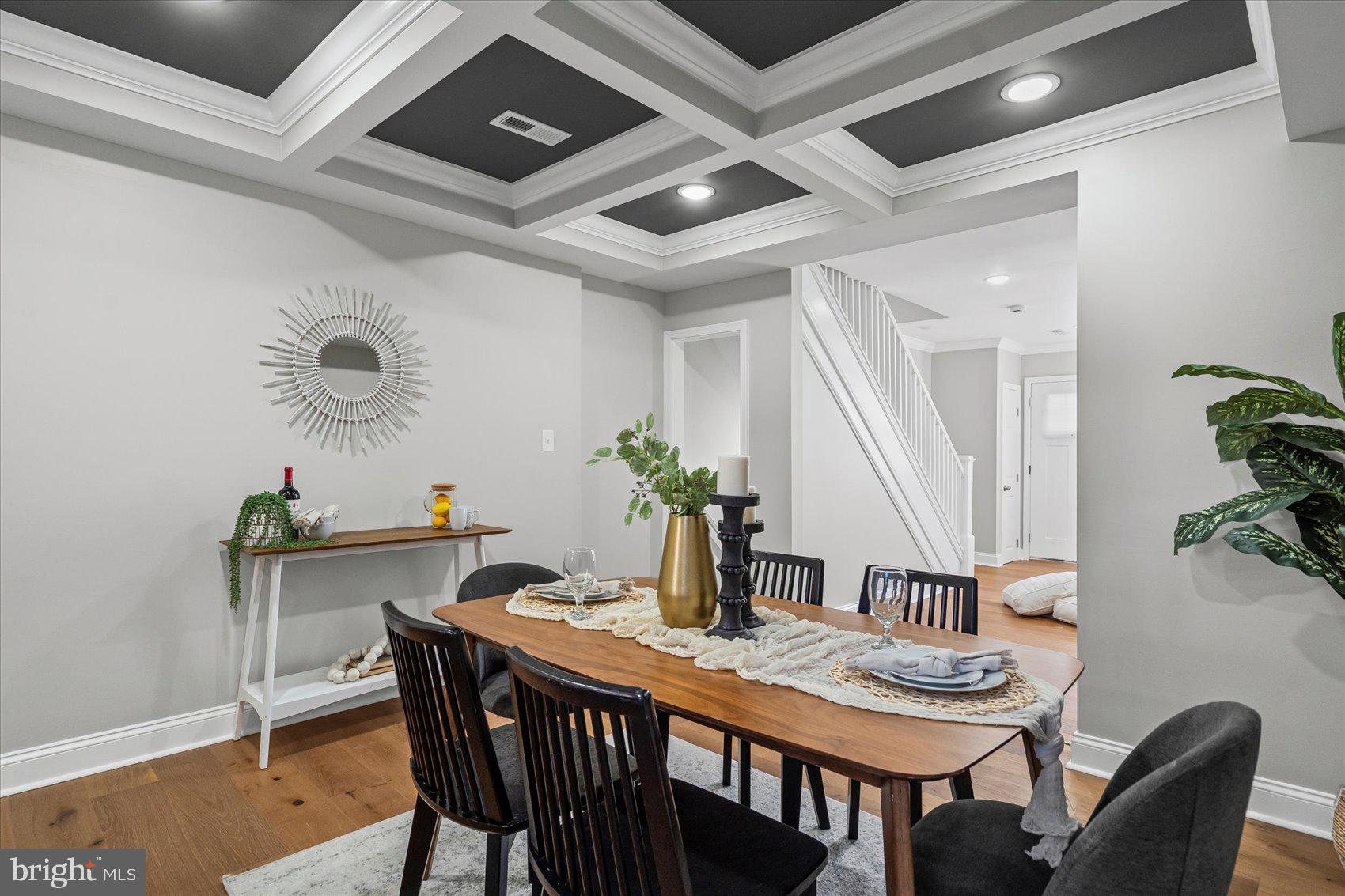 3814 Flowerton Road Baltimore, MD 21229 - Photo 13 of 42 a view of a dining room with furniture and wooden floor