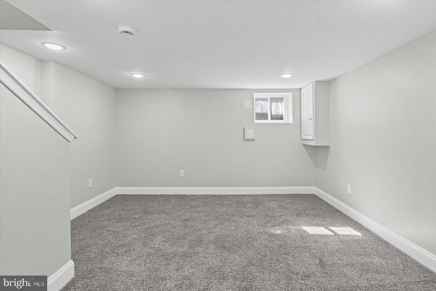 3814 Flowerton Road Baltimore, MD 21229 - Photo 14 of 42 an empty room with a empty space and windows