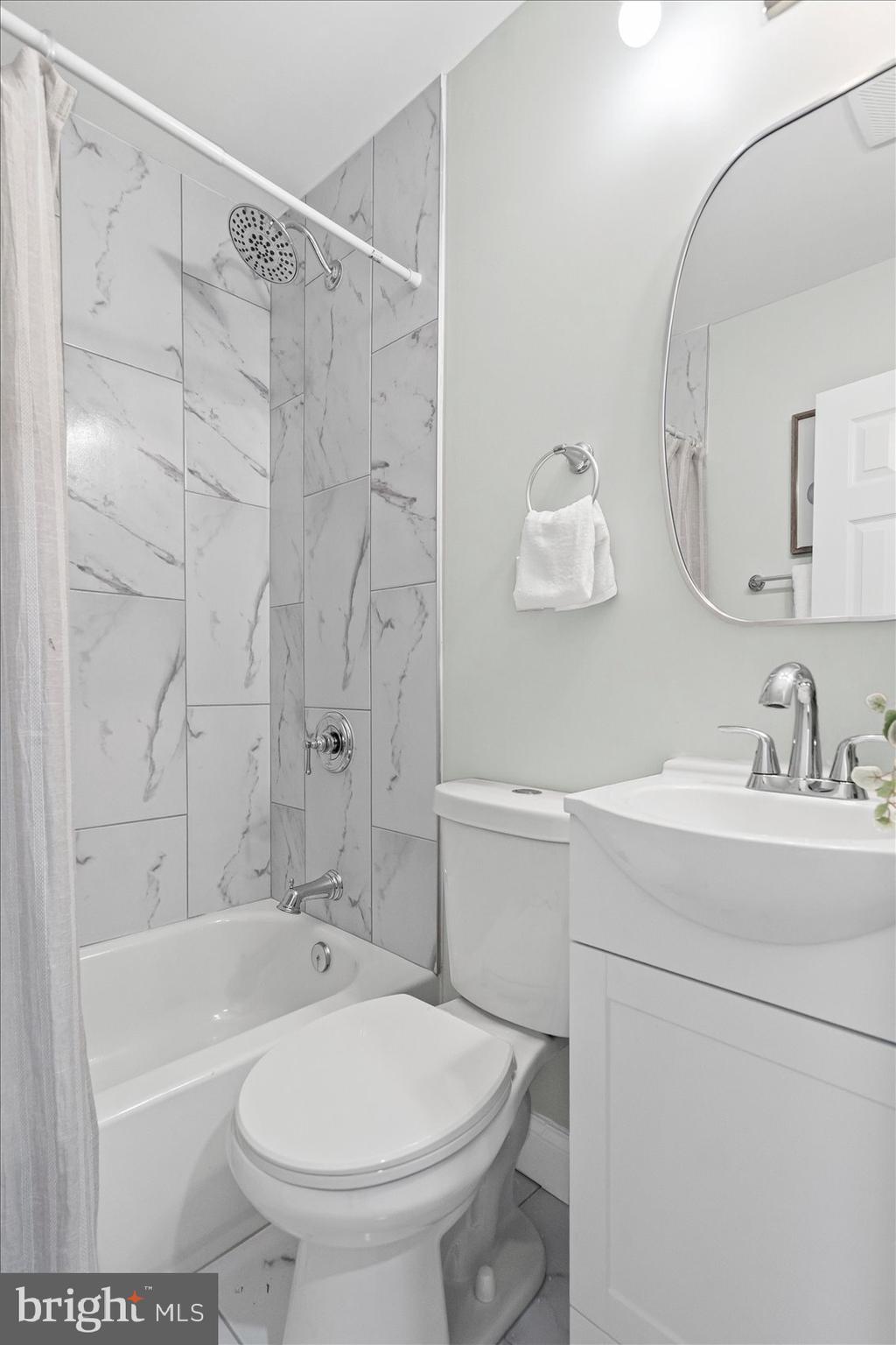 3814 Flowerton Road Baltimore, MD 21229 - Photo 29 of 42 a bathroom with a sink toilet and shower