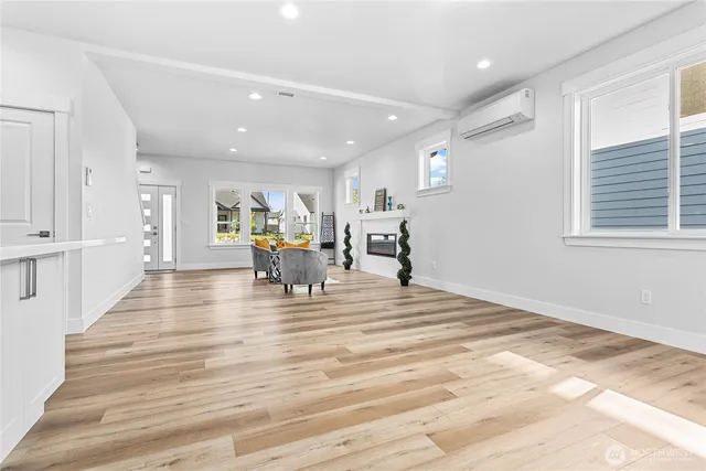 a view of kitchen and dining room with wooden floor