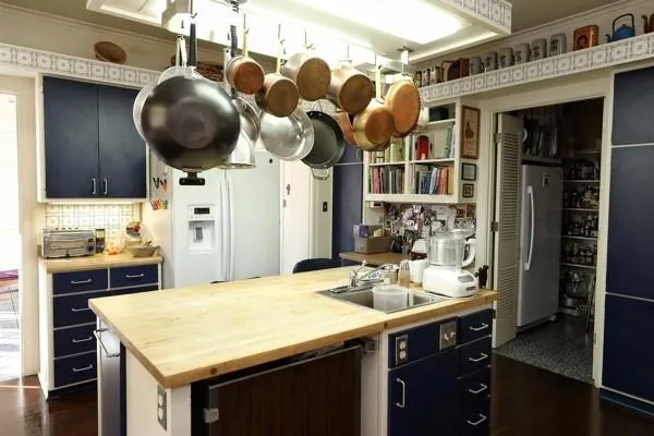 a kitchen with a sink cabinets and appliances