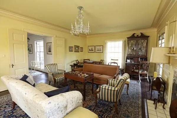 a living room with furniture chandelier and a chandelier