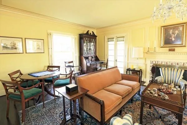 a living room with furniture and a floor to ceiling window