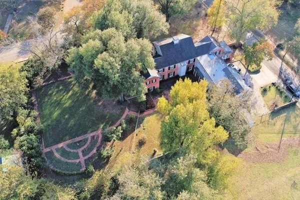 a view of a swimming pool with a yard