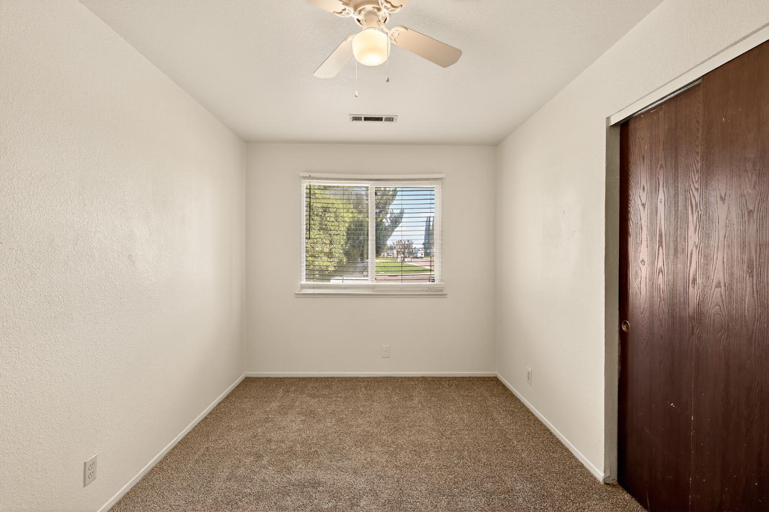 2915 Balsam Way Merced, CA 95348 - Photo 20 of 40 an empty room with a window