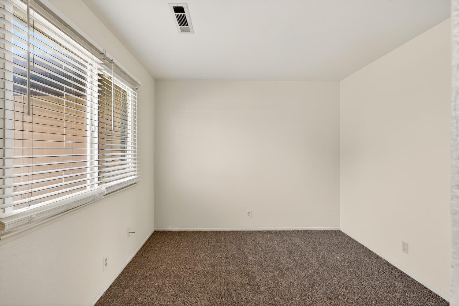 2915 Balsam Way Merced, CA 95348 - Photo 22 of 40 an empty room with a window