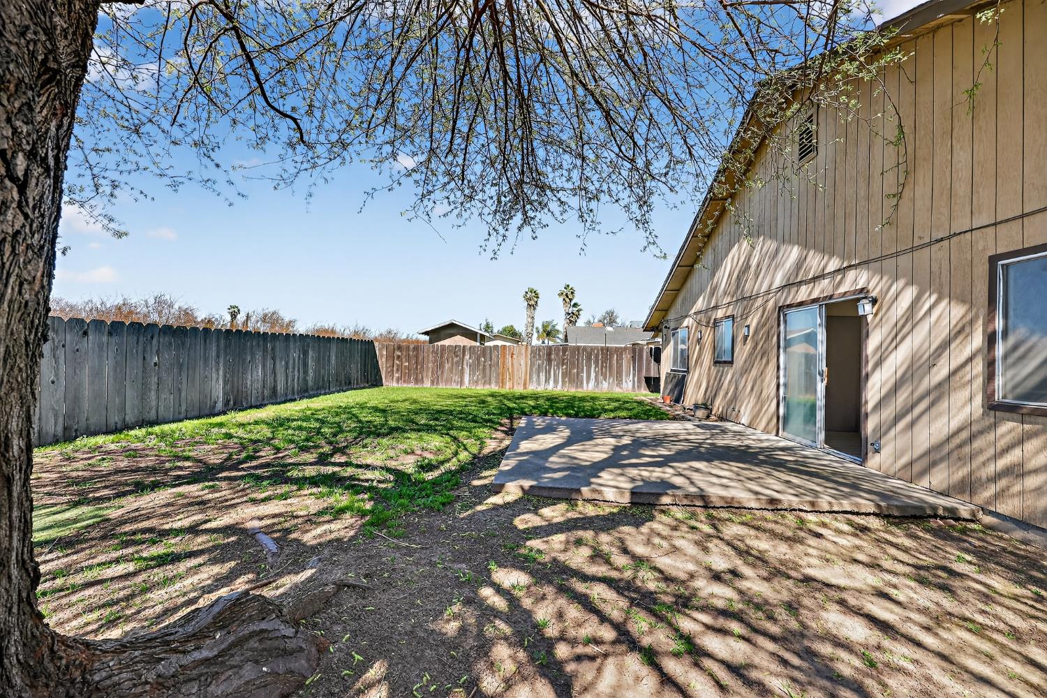 2915 Balsam Way Merced, CA 95348 - Photo 33 of 40 a view of a backyard with a tree