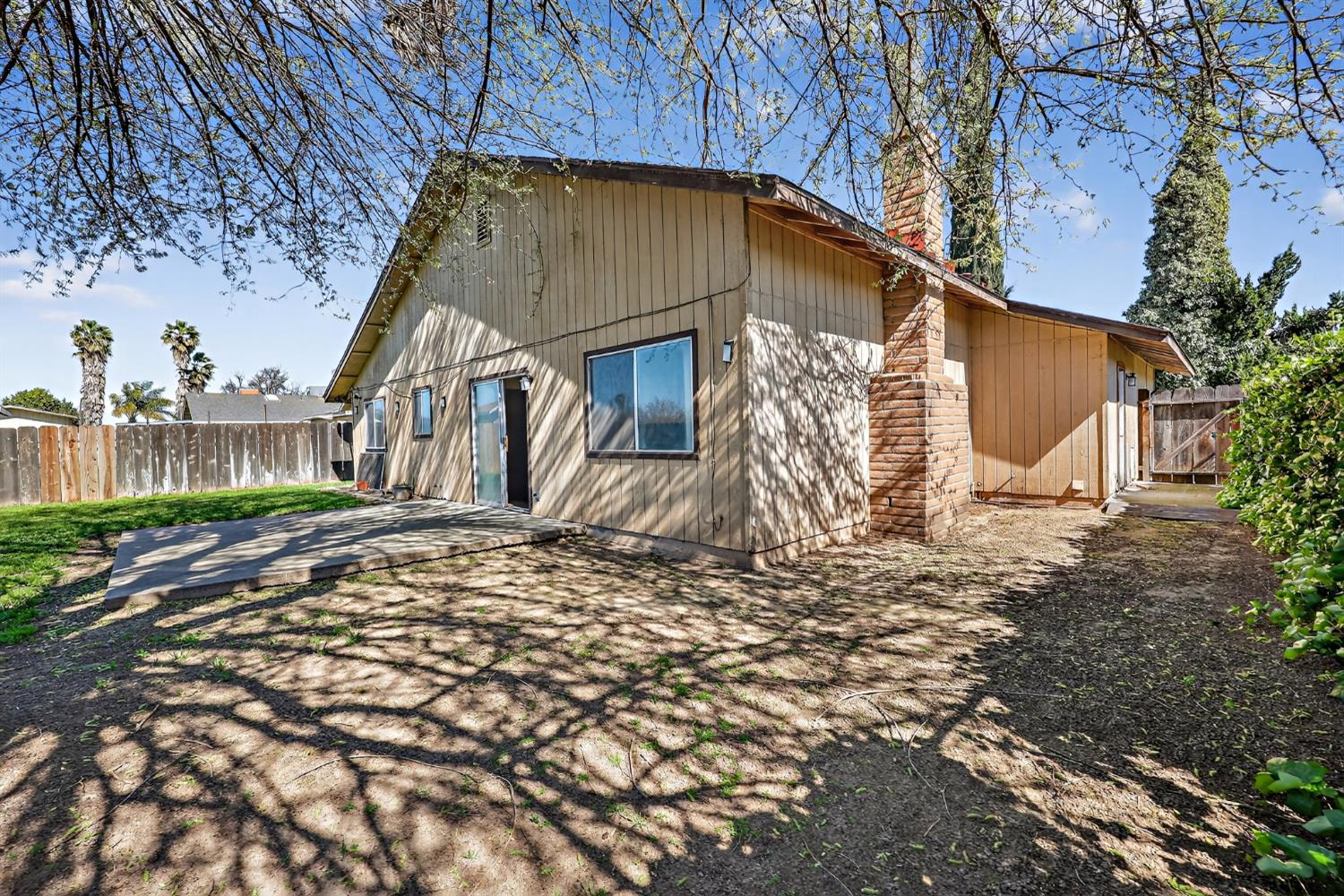 2915 Balsam Way Merced, CA 95348 - Photo 34 of 40 a house that has a tree in front of it