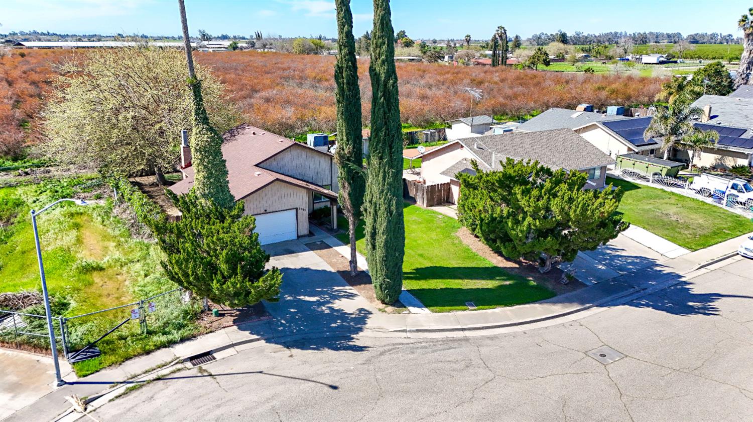 2915 Balsam Way Merced, CA 95348 - Photo 39 of 40 a view of a city street from a bench