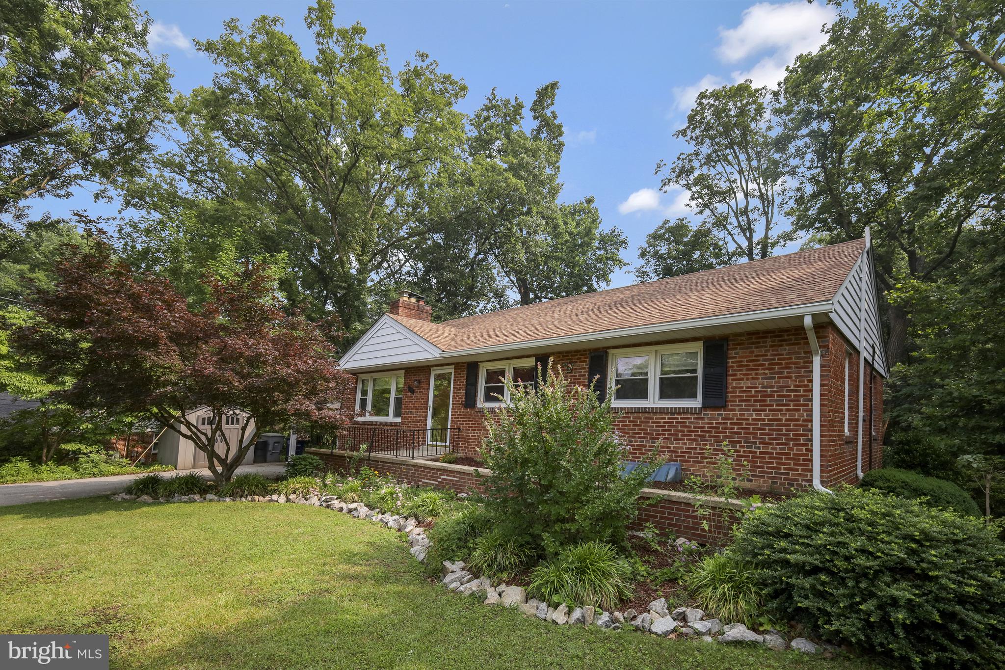 street view of front of all brick home