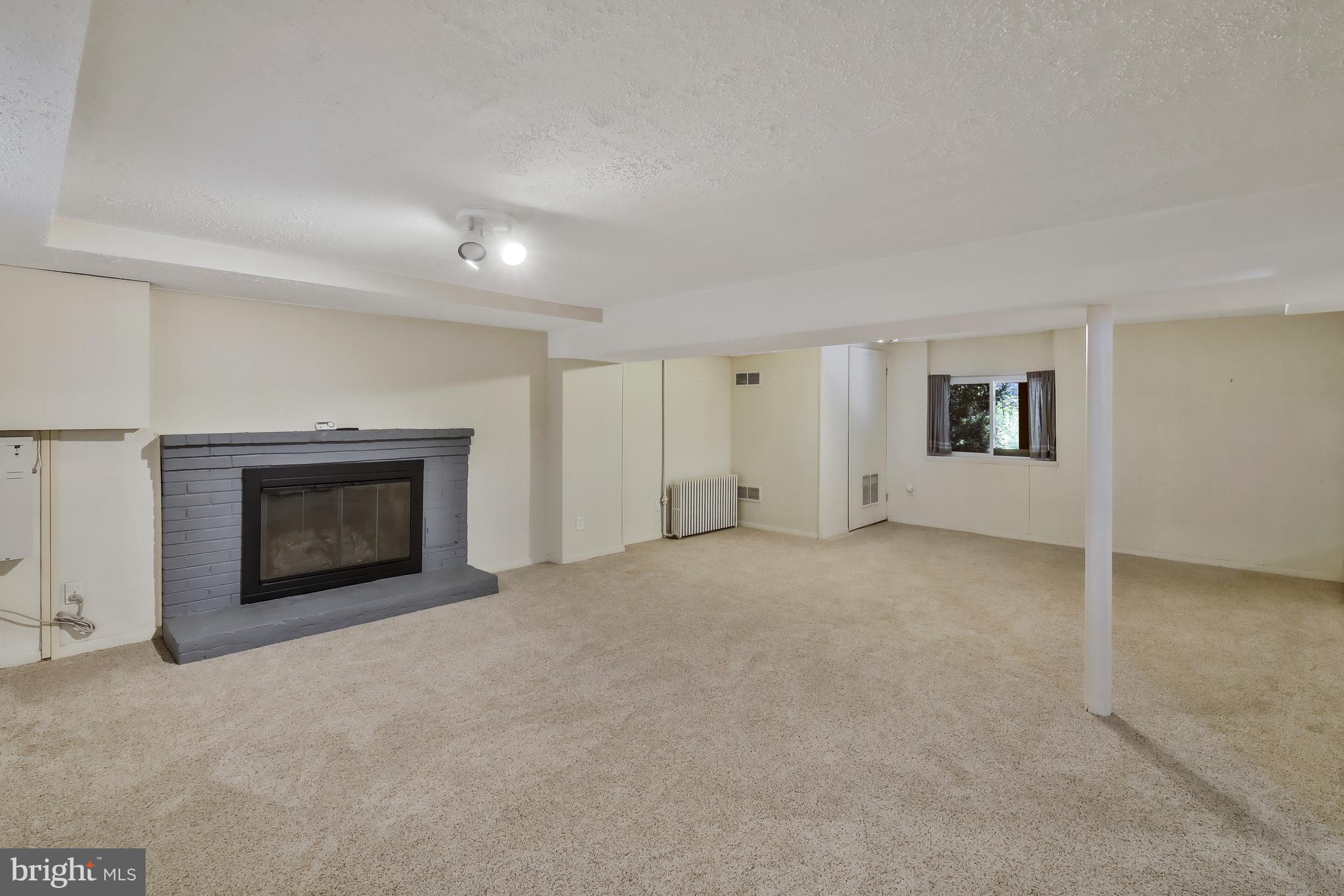 5512 Brookland Road Alexandria, VA 22310 - Photo 26 of 34 Huge basement family room w/ 2nd gas fireplace