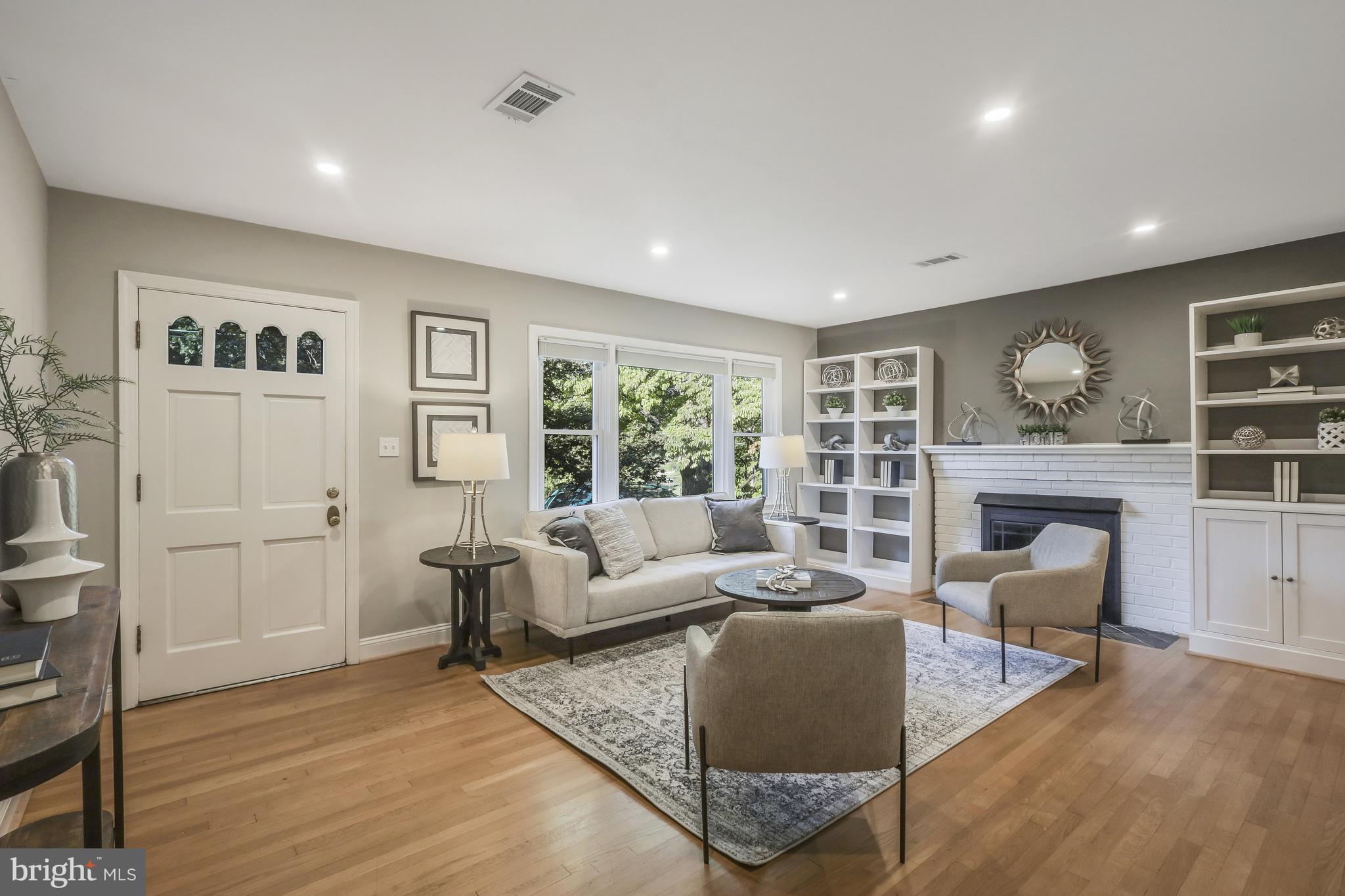 5512 Brookland Road Alexandria, VA 22310 - Photo 5 of 34 Living room w/ gas fireplace & hardwood floors