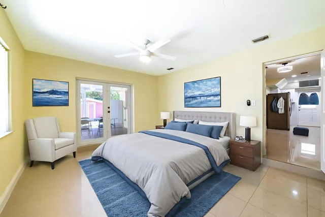 a bathroom with a granite countertop sink and shower