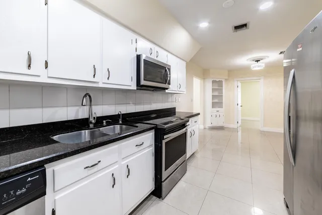 a bedroom with a bed and a plant