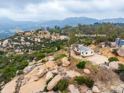a view of a chairs and table in patio