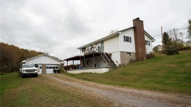 a view of a house with a back yard