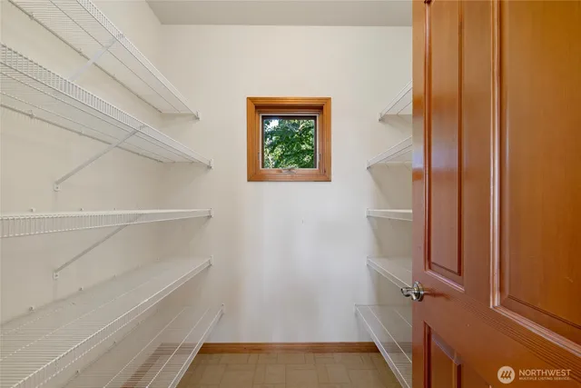 a view of a chair and table in the garden