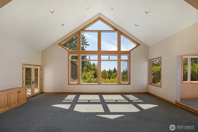 a view of an empty room with windows