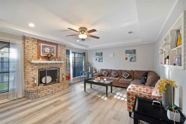a living room with furniture and a fireplace