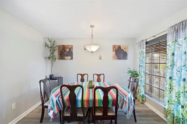 a dining room with furniture and window