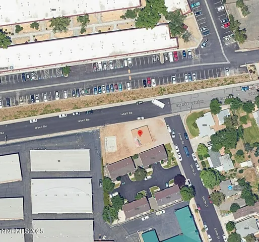 a couple of cars parked in front of a house