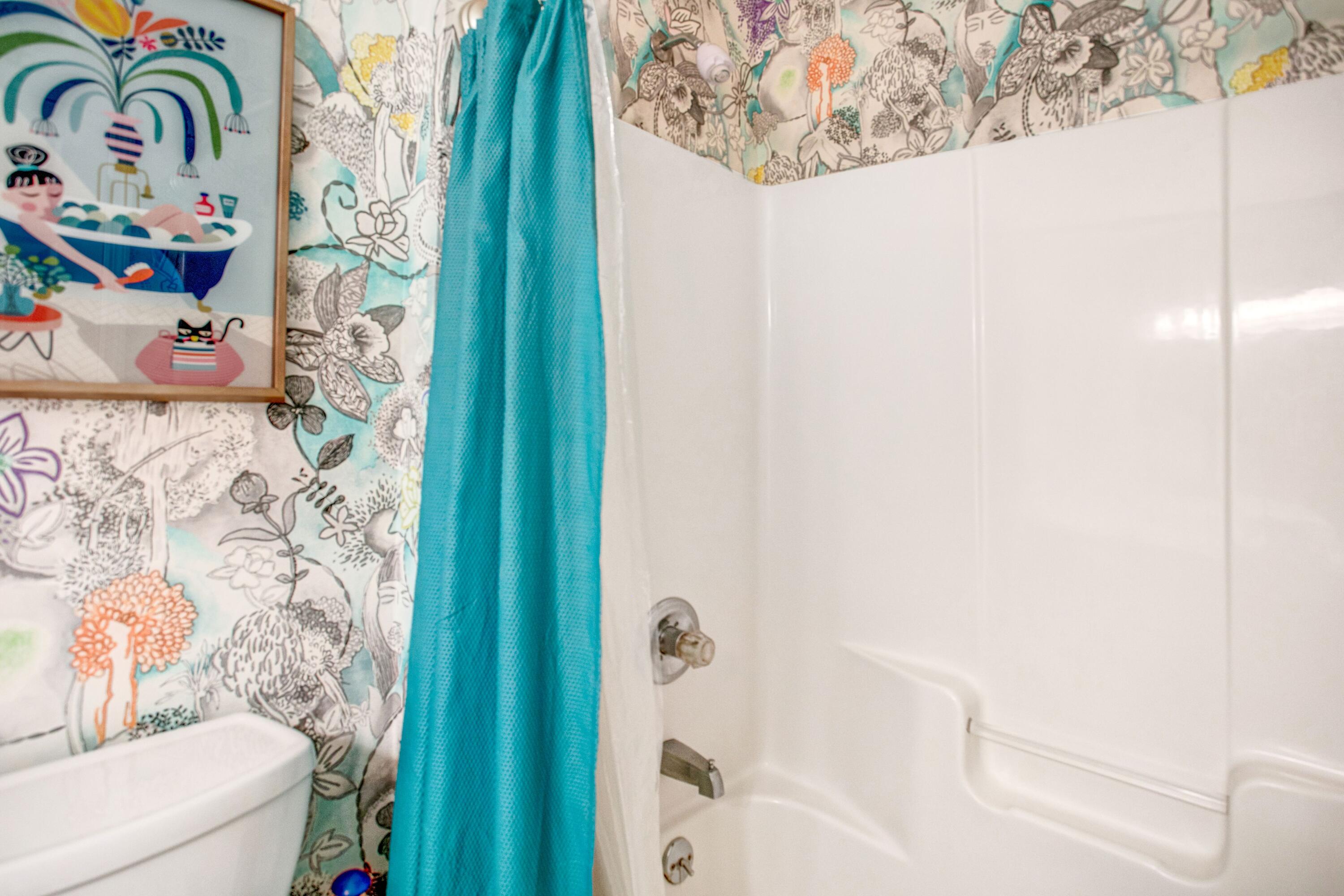 285 Payne Street, Unit 5A Miramar Beach, FL 32550 - Photo 12 of 20 a bathroom with a bathtub and a shower curtain