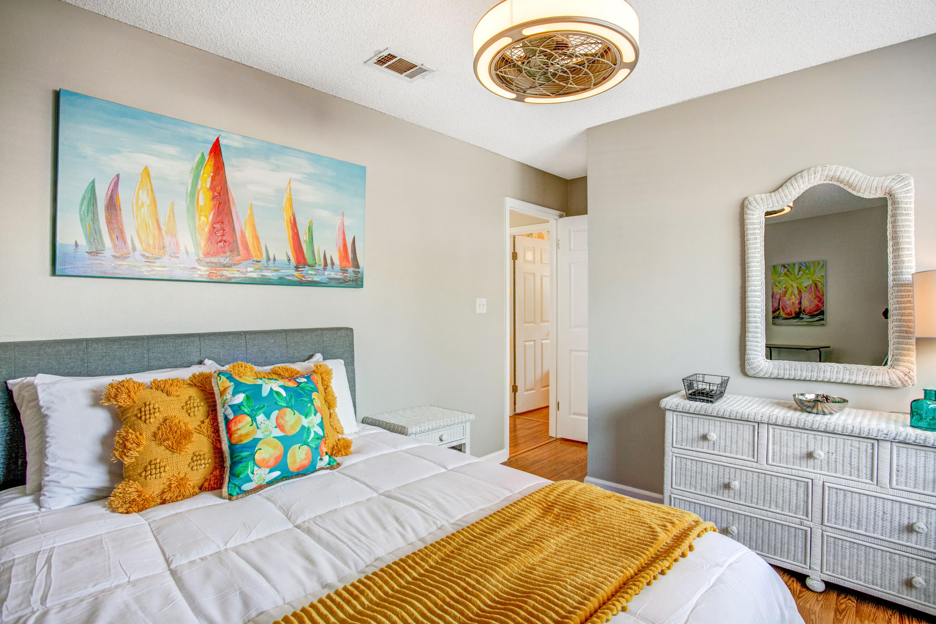 285 Payne Street, Unit 5A Miramar Beach, FL 32550 - Photo 13 of 20 a bedroom with a bed and a chandelier