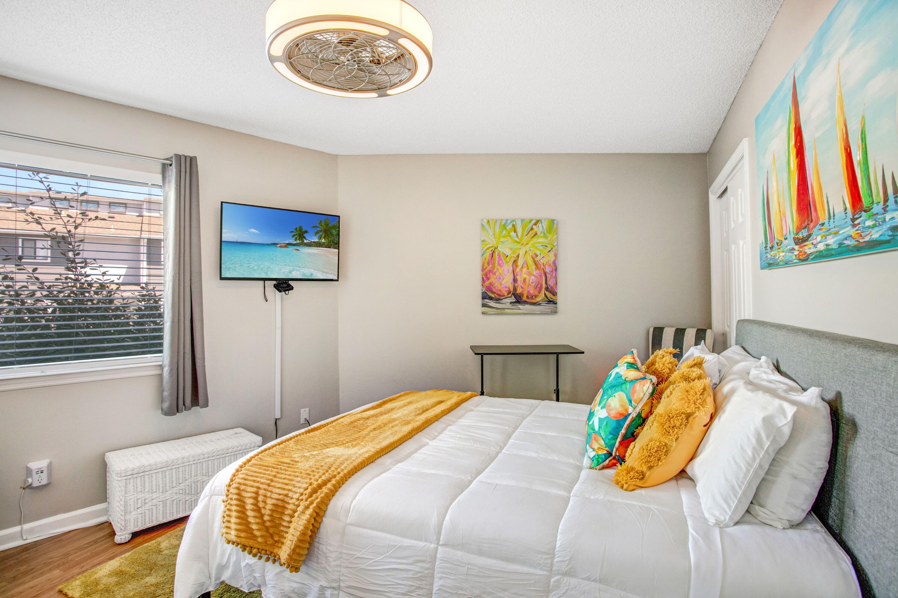 285 Payne Street, Unit 5A Miramar Beach, FL 32550 - Photo 14 of 20 a bedroom with a bed and a flat screen tv