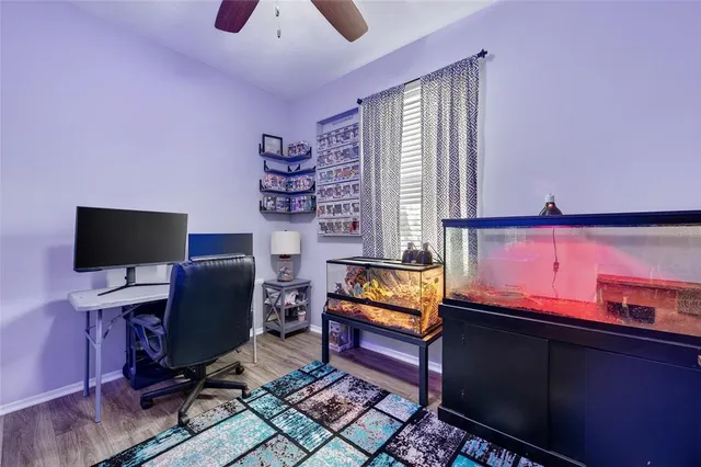 a reading room with furniture and a flat screen tv