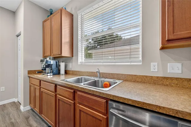 a spacious bedroom with a bed and a chandelier