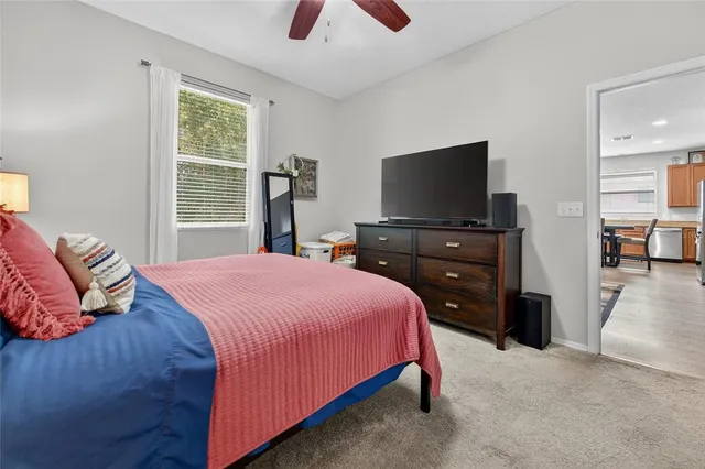 a bathroom with a tub sink and shower