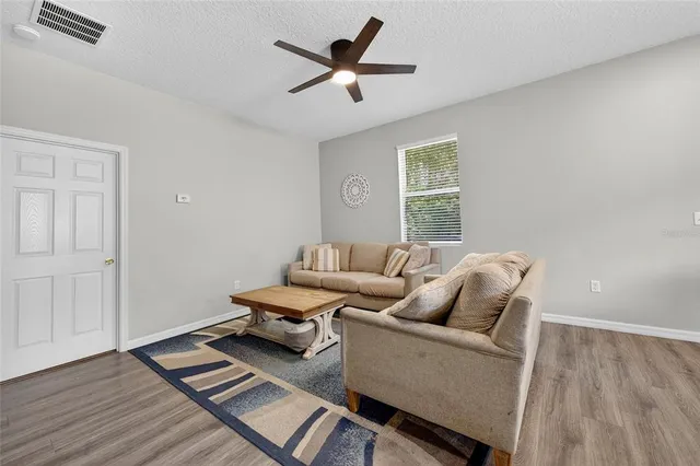 a living room with furniture and a window