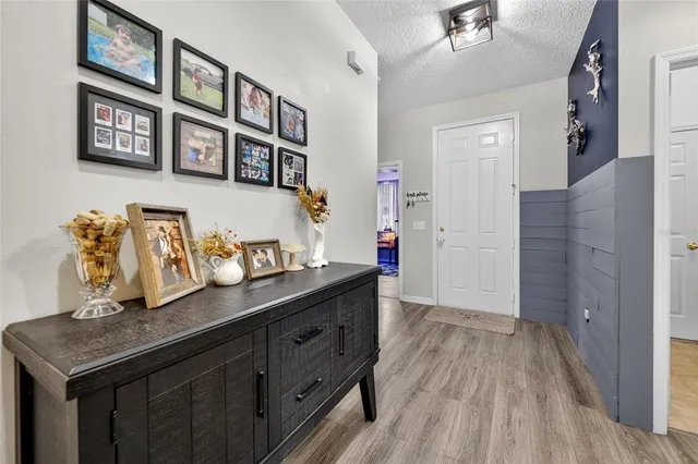 a kitchen with stainless steel appliances granite countertop a sink and a refrigerator