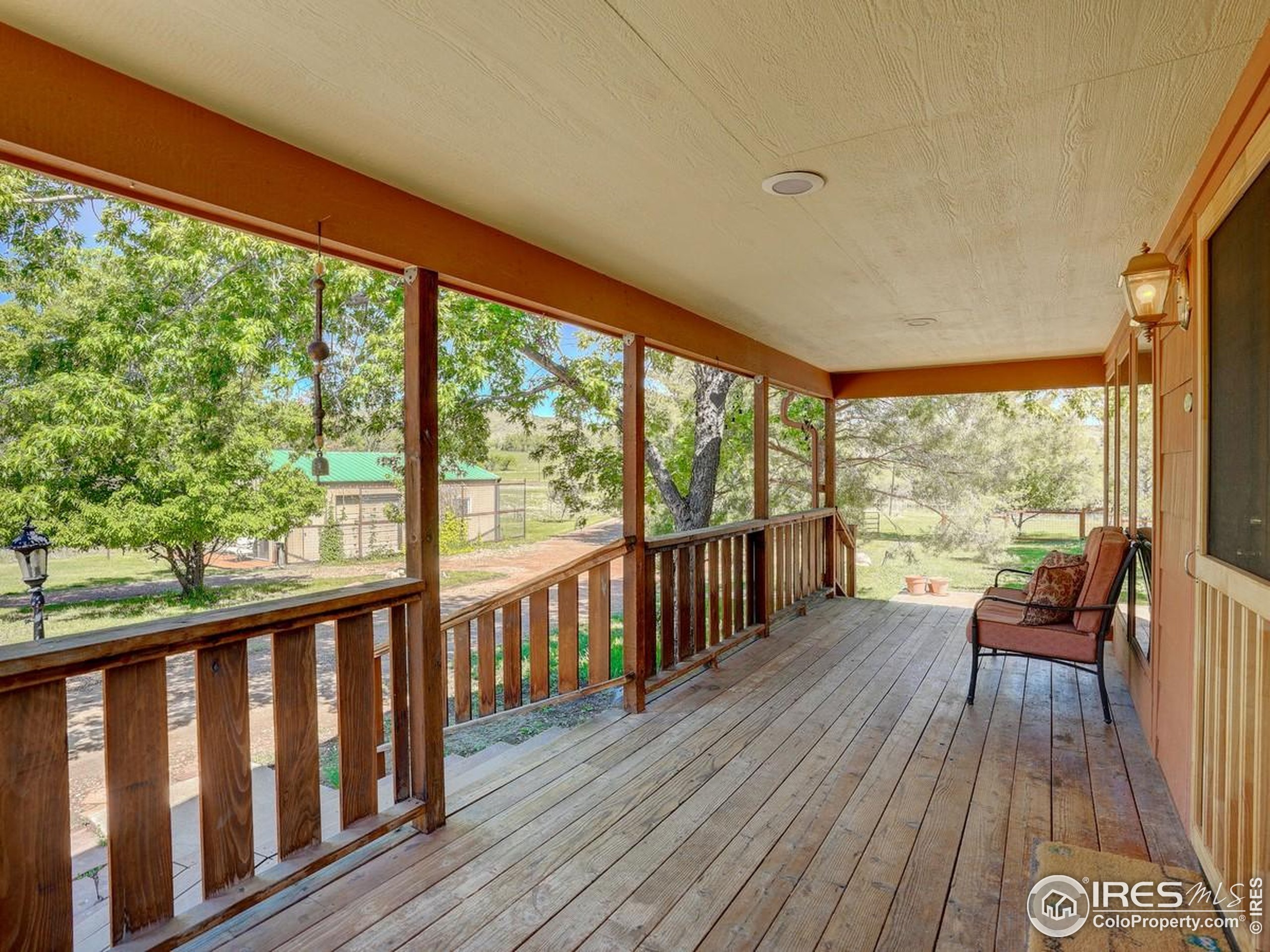 5196 Oxford Road Longmont, CO 80503 - Photo 19 of 38 a view of a two room with wooden floor and furniture