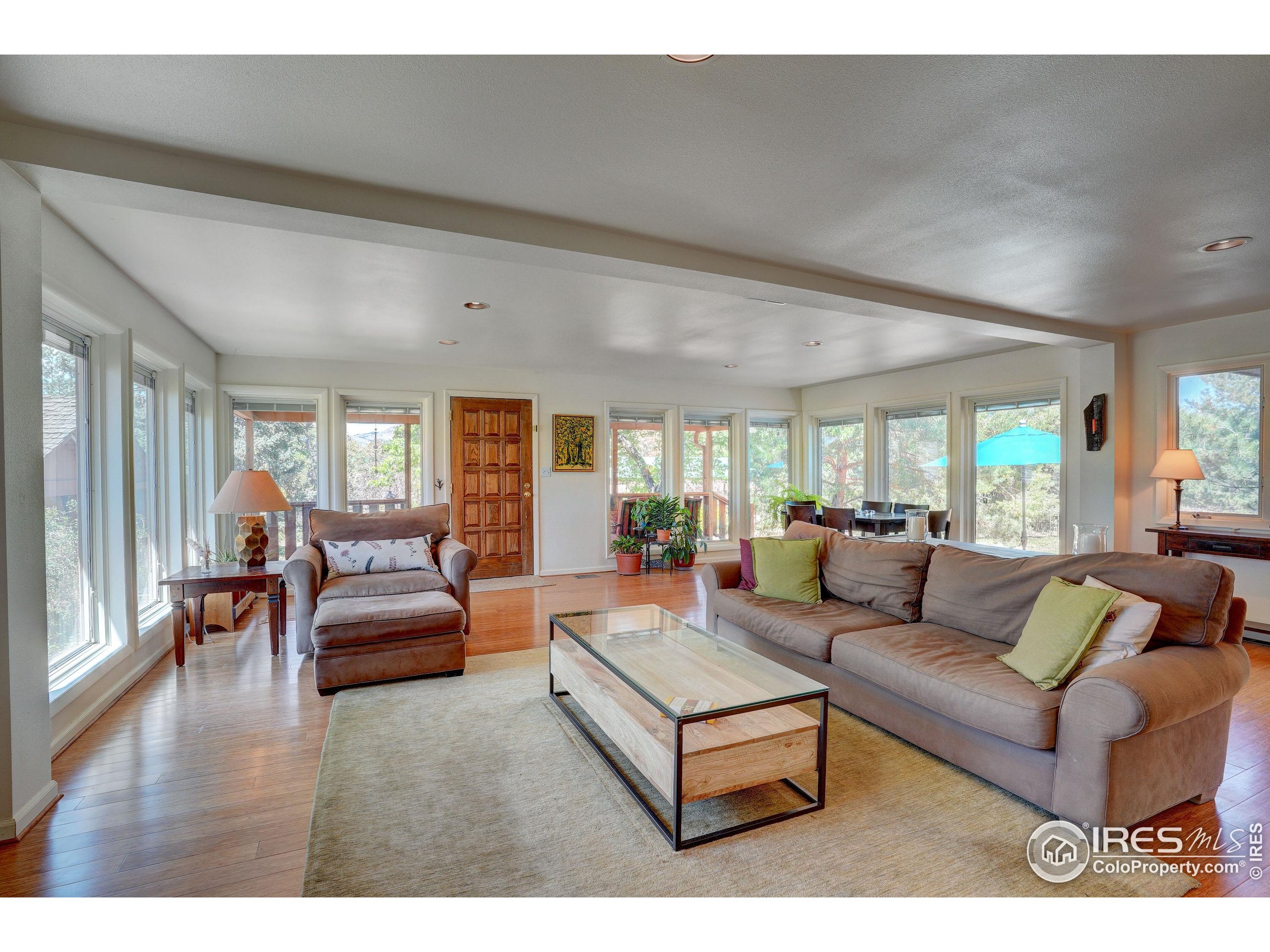5196 Oxford Road Longmont, CO 80503 - Photo 20 of 38 a living room with furniture and a wooden floor