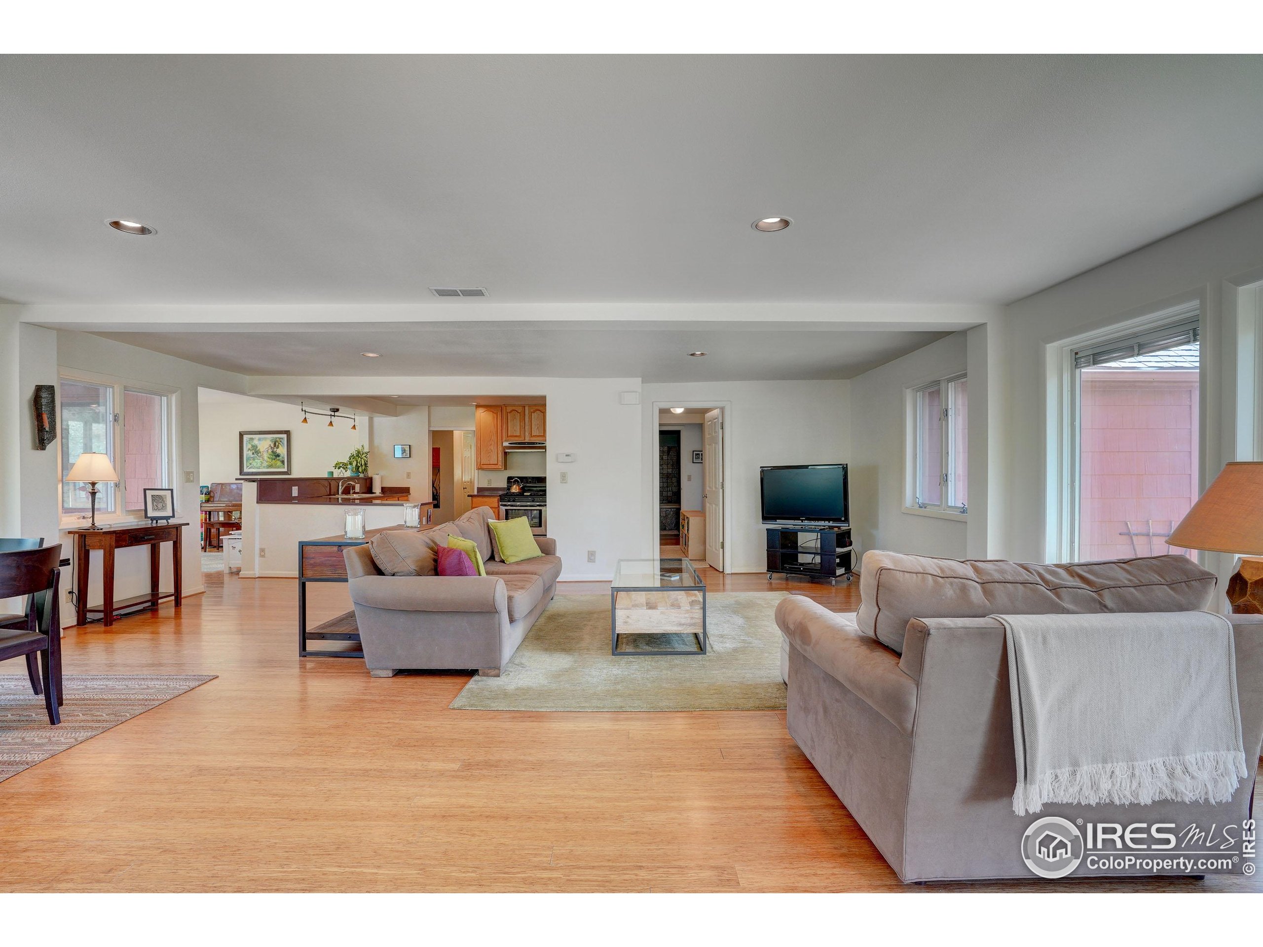 5196 Oxford Road Longmont, CO 80503 - Photo 23 of 38 a living room with furniture and a wooden floor