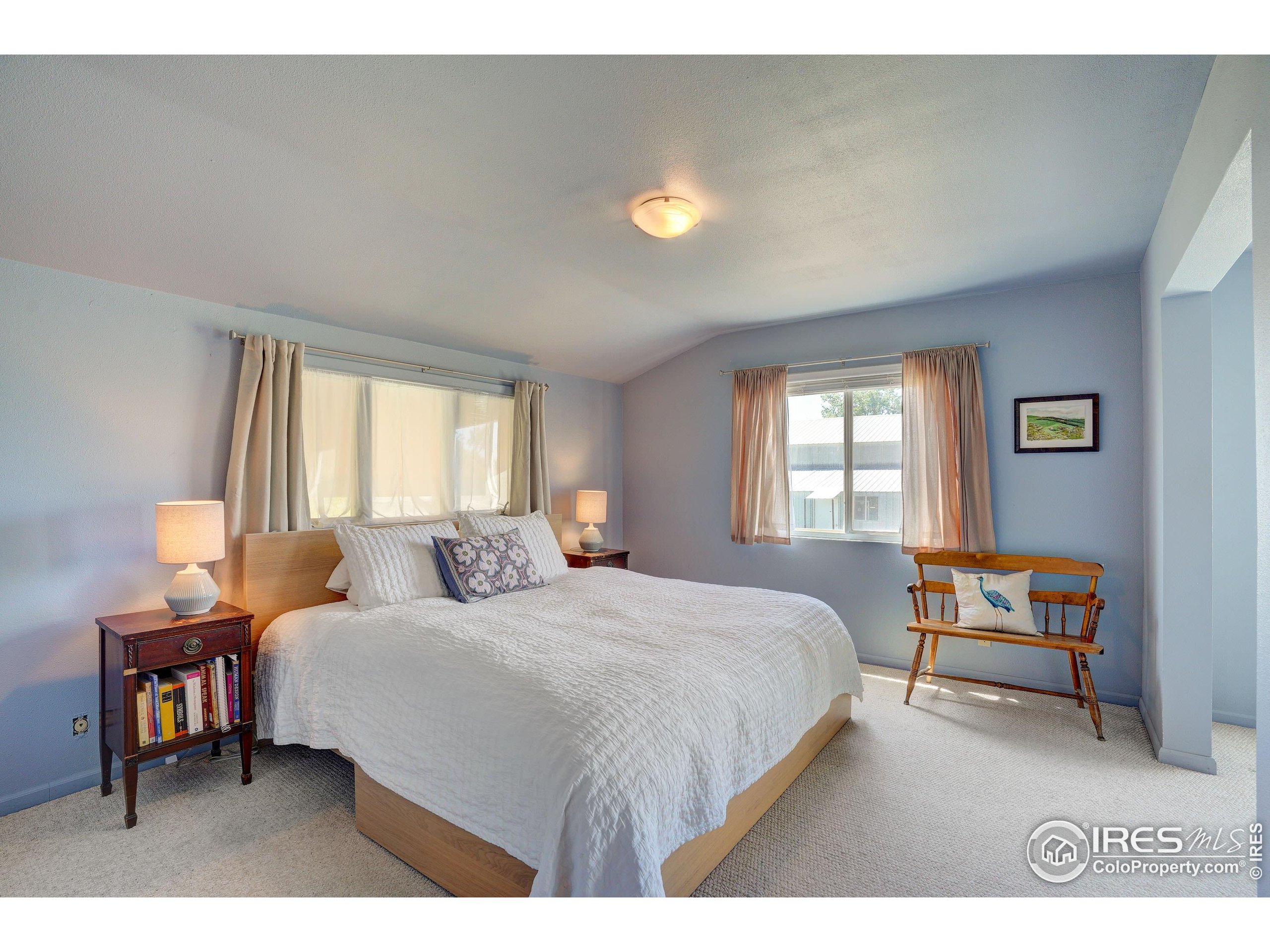 5196 Oxford Road Longmont, CO 80503 - Photo 25 of 38 a bedroom with two beds and a window