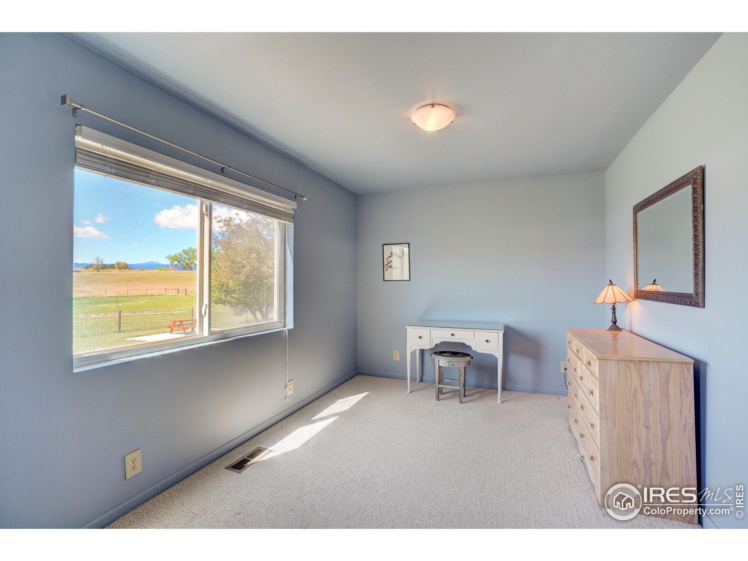 5196 Oxford Road Longmont, CO 80503 - Photo 27 of 38 a living room with furniture and a window