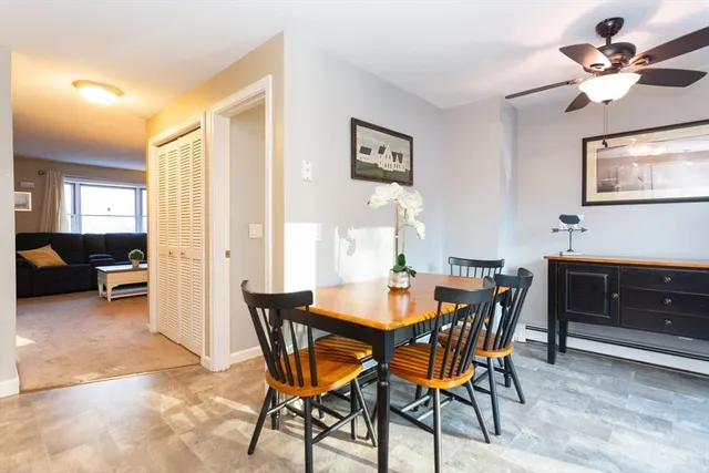 a view of a dining room with furniture and a livingroom