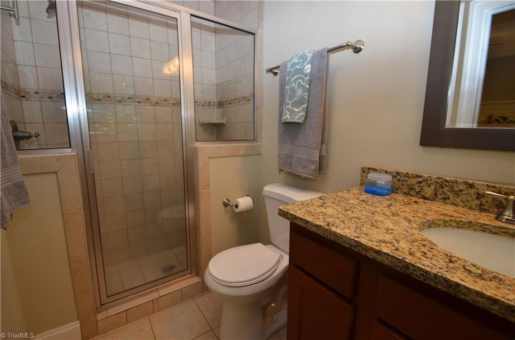 1025 Huntingdon Road Winston-Salem, NC 27104 - Photo 11 of 26 Master bath with granite counter and tiled shower.