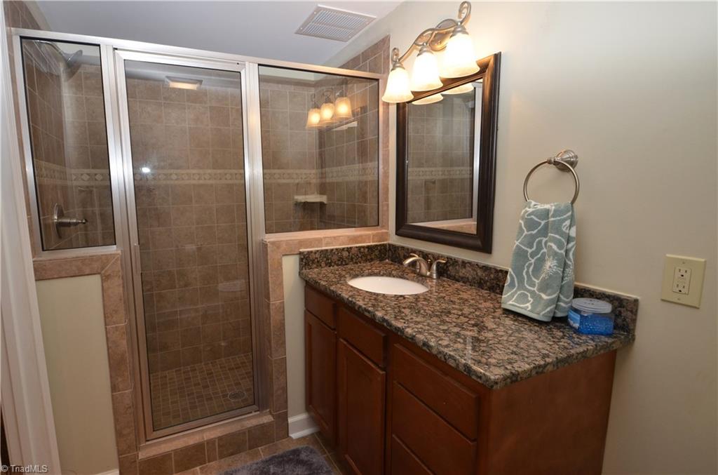 1025 Huntingdon Road Winston-Salem, NC 27104 - Photo 19 of 26 Basement bath with granite counter and huge tiled shower.