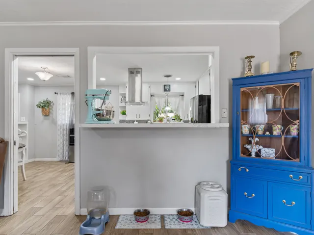 a dining room with table and wooden floor