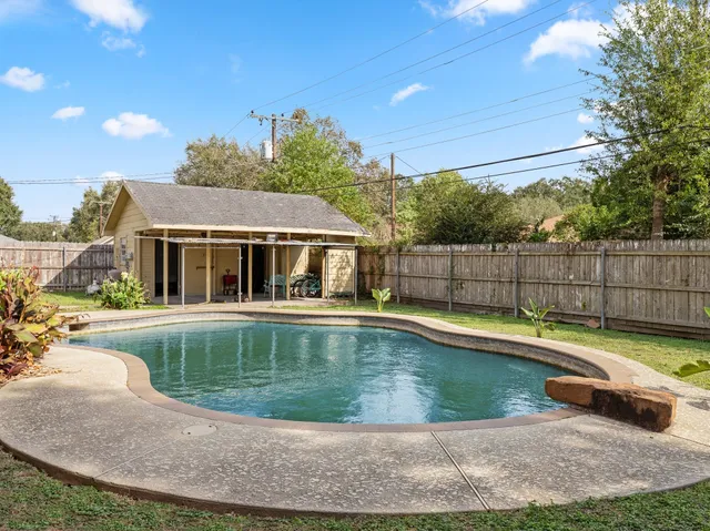 a view of swimming pool with seating space