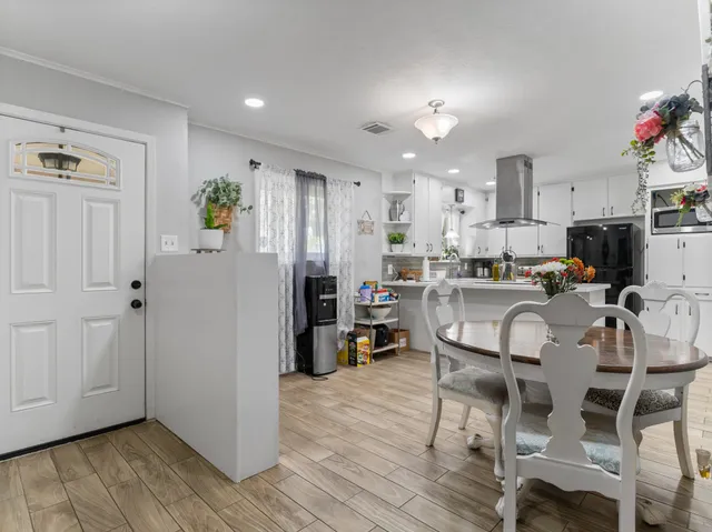 a view of kitchen dining table and chairs