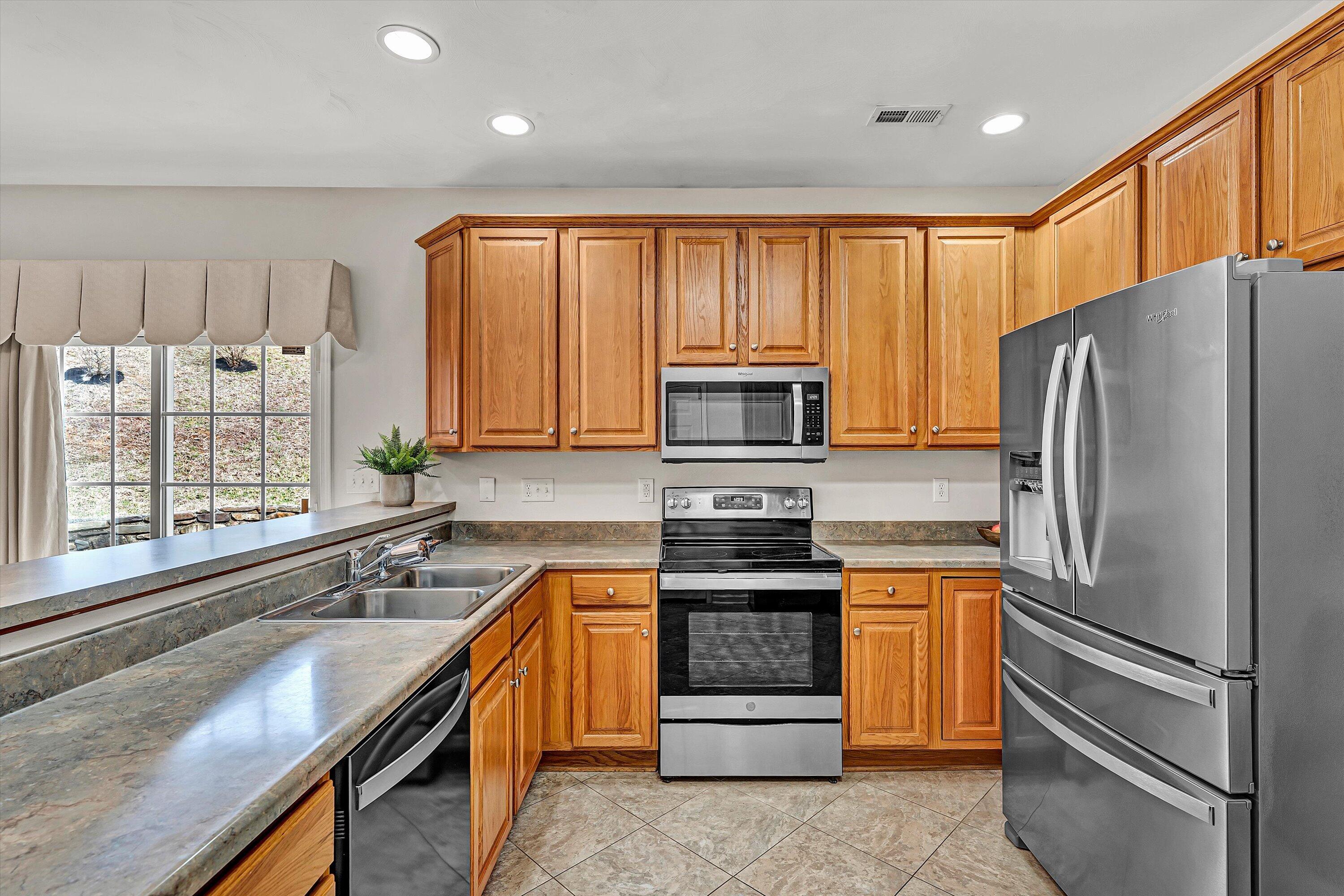 1365 Aarons Run Circle Salem, VA 24153 - Photo 12 of 35 a kitchen with a refrigerator and a sink